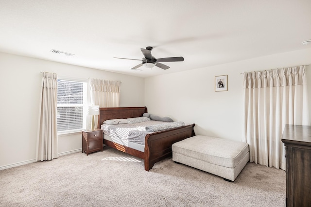 bedroom with light carpet and ceiling fan