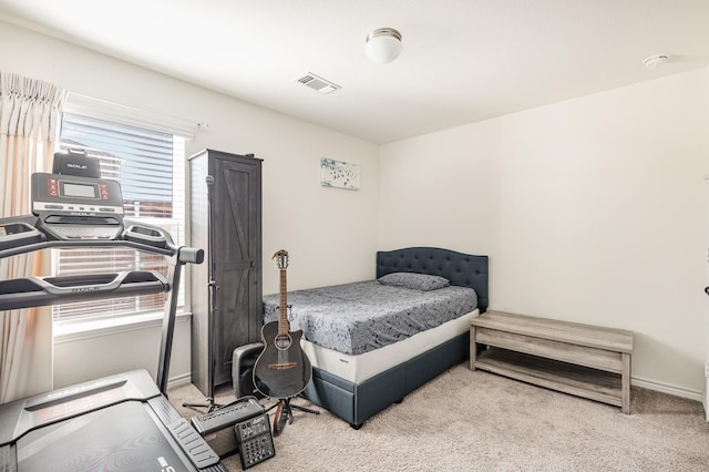 bedroom with light colored carpet