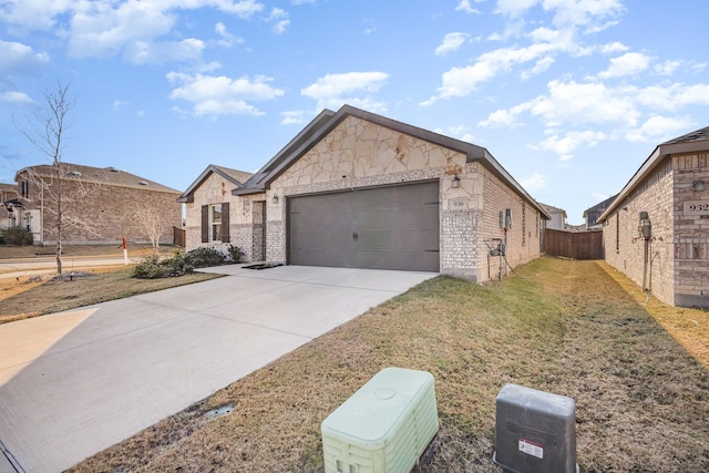 view of front of property featuring a garage and a front yard