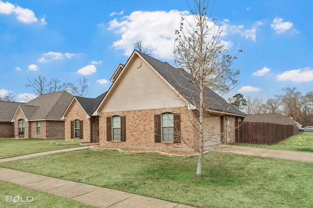 view of front of property featuring a garage and a front yard