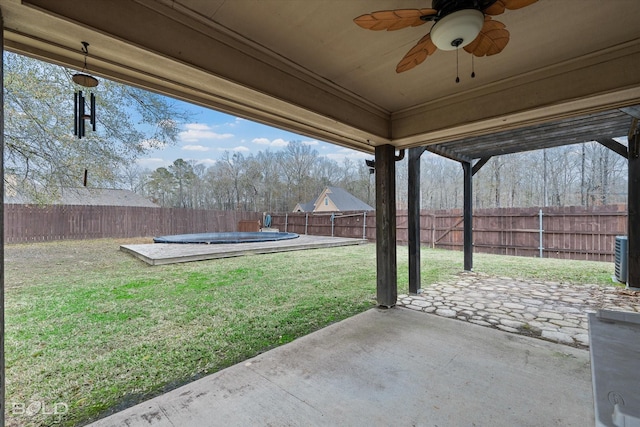 exterior space with ceiling fan and a covered pool