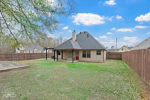 back of house featuring a lawn, ceiling fan, a patio area, and a deck