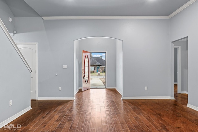 foyer with crown molding and dark hardwood / wood-style floors