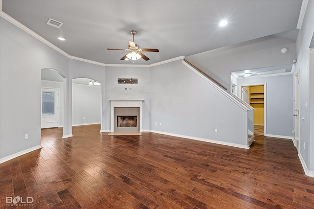 unfurnished living room with ceiling fan, dark hardwood / wood-style flooring, and ornamental molding