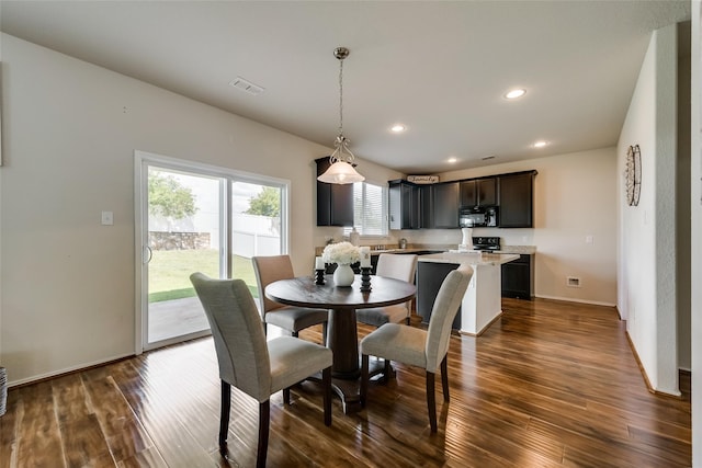 dining area featuring dark hardwood / wood-style floors