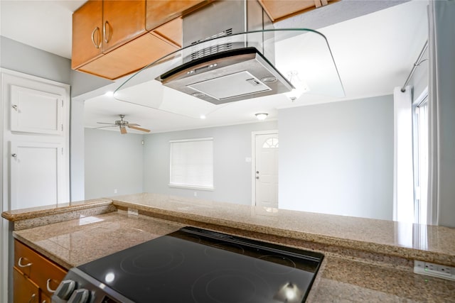 kitchen featuring range and ceiling fan