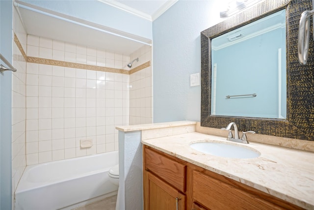 full bathroom with tiled shower / bath combo, ornamental molding, vanity, and toilet