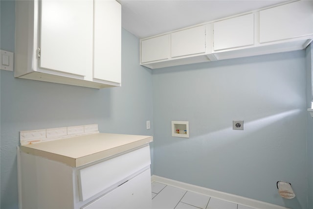 laundry area with cabinets, washer hookup, light tile patterned floors, and electric dryer hookup