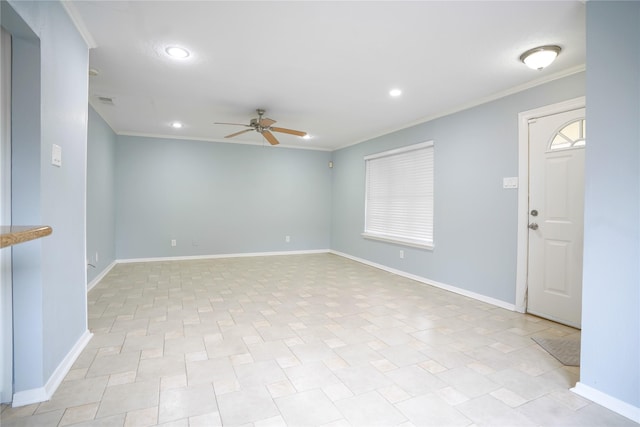 spare room with crown molding and ceiling fan