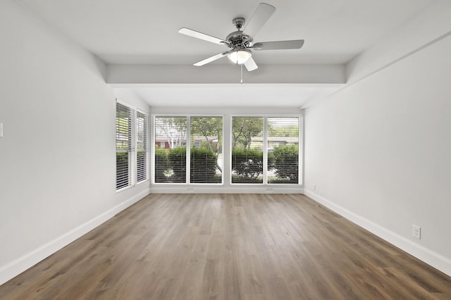 spare room with ceiling fan and hardwood / wood-style flooring