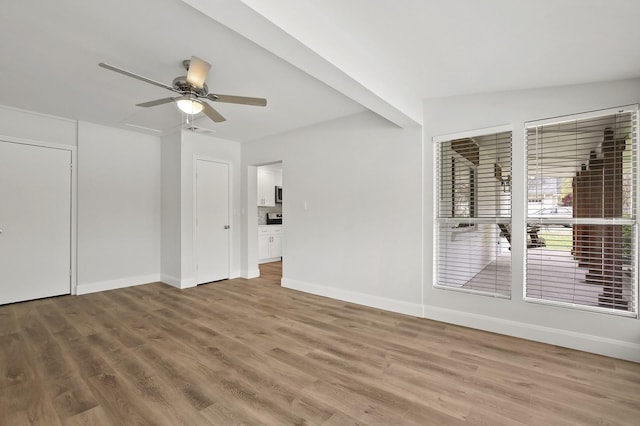 unfurnished room with hardwood / wood-style flooring and ceiling fan