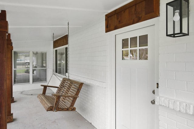 doorway to property with covered porch