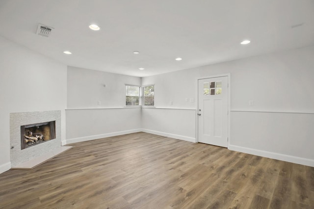 unfurnished living room featuring wood-type flooring