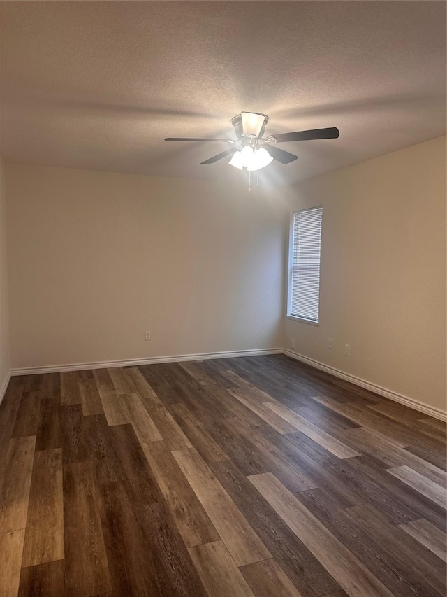 unfurnished room with a textured ceiling, dark hardwood / wood-style floors, and ceiling fan