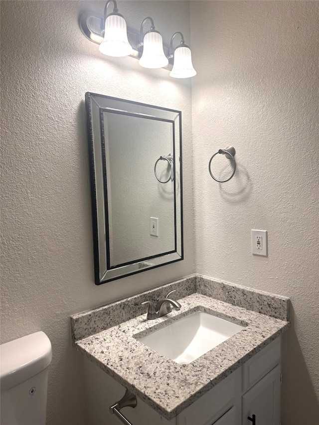 bathroom featuring toilet and sink