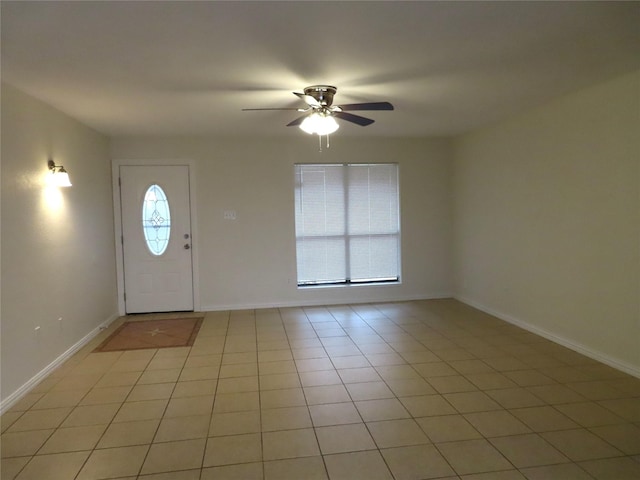 foyer entrance featuring ceiling fan and light tile patterned flooring