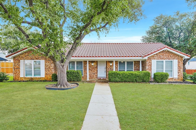 ranch-style home featuring a front yard