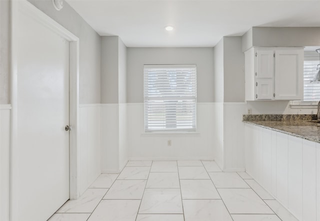 unfurnished dining area featuring sink