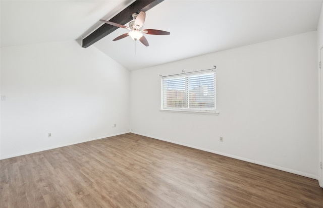 empty room with lofted ceiling with beams, ceiling fan, and hardwood / wood-style floors