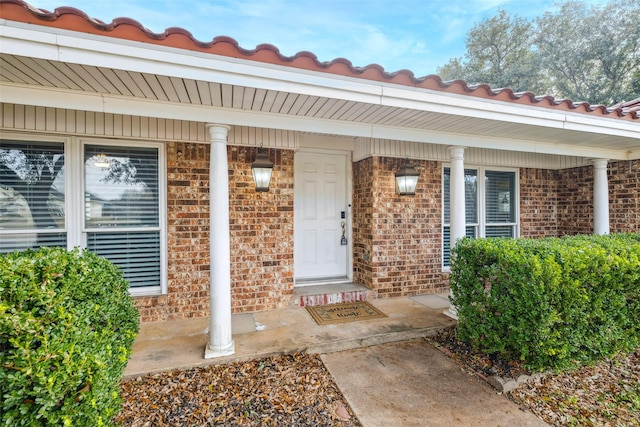 doorway to property with a porch