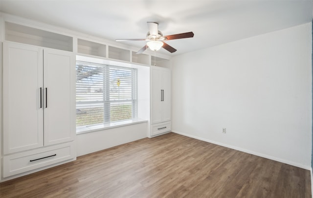 interior space with hardwood / wood-style flooring and ceiling fan