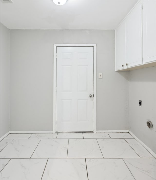 laundry room featuring cabinets and hookup for an electric dryer