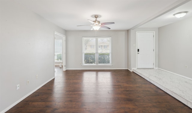 unfurnished room with dark hardwood / wood-style floors and ceiling fan