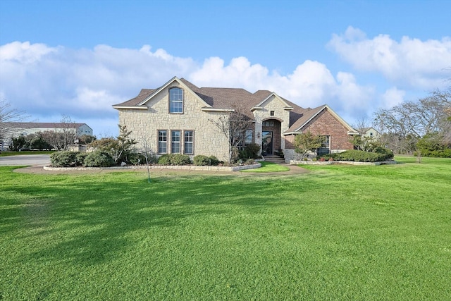 view of front of home with a front lawn