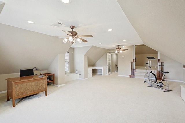 interior space with ceiling fan, light colored carpet, and lofted ceiling