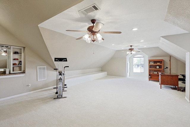 workout area with light carpet, ceiling fan, and lofted ceiling