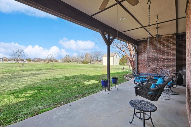 view of patio / terrace featuring outdoor lounge area and a storage unit