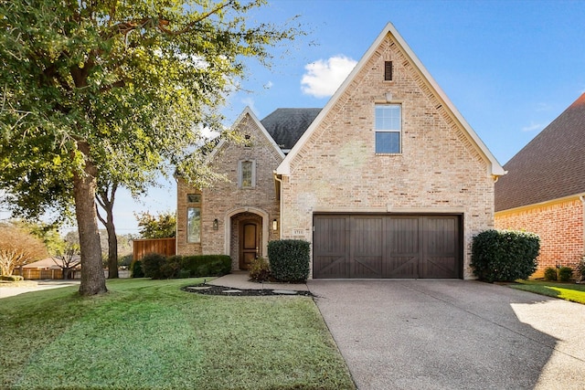 view of front of home featuring a garage and a front lawn