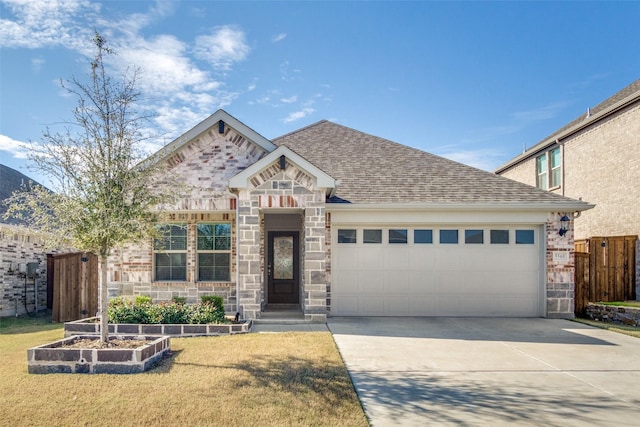 view of front of home featuring a front lawn and a garage