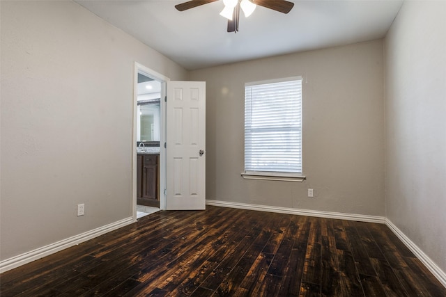 empty room featuring ceiling fan, dark hardwood / wood-style floors, and sink