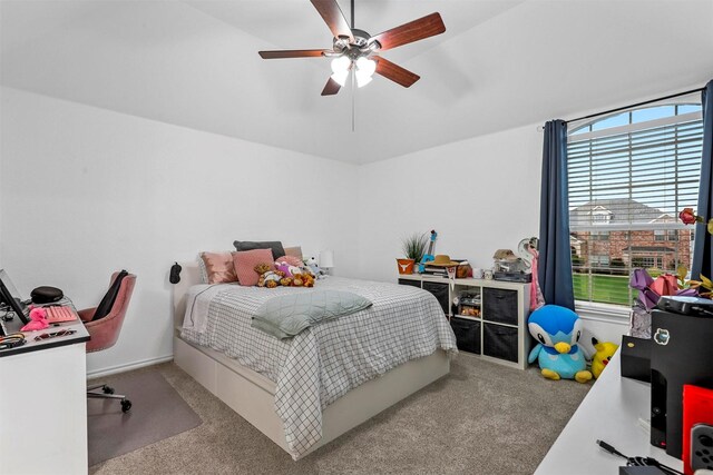 carpeted bedroom featuring multiple windows and a ceiling fan