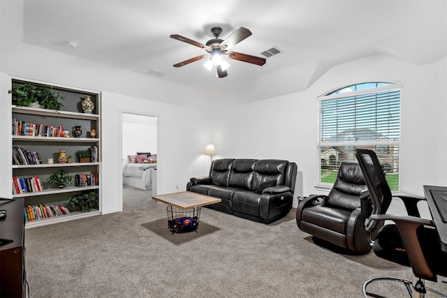 living room with carpet floors, ceiling fan, lofted ceiling, and visible vents