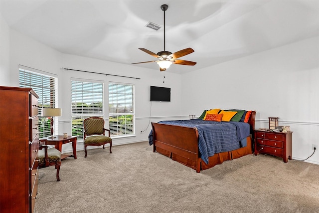 bedroom featuring carpet floors, ceiling fan, and visible vents