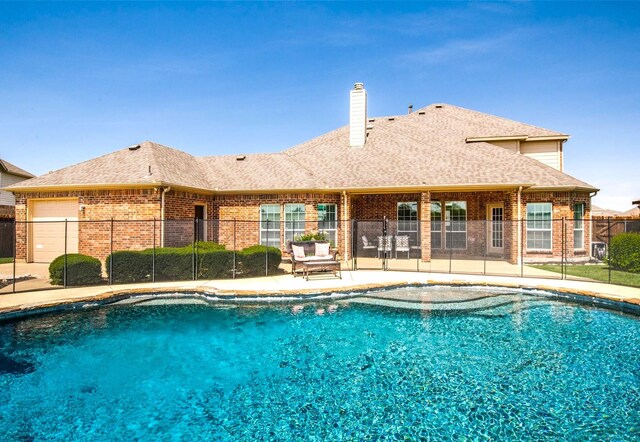 view of swimming pool featuring a patio area