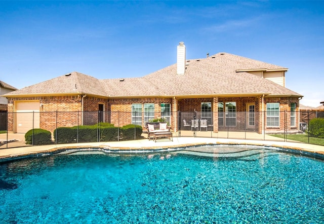 view of pool with fence, a fenced in pool, and a patio area