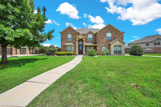 traditional home featuring a front lawn and brick siding