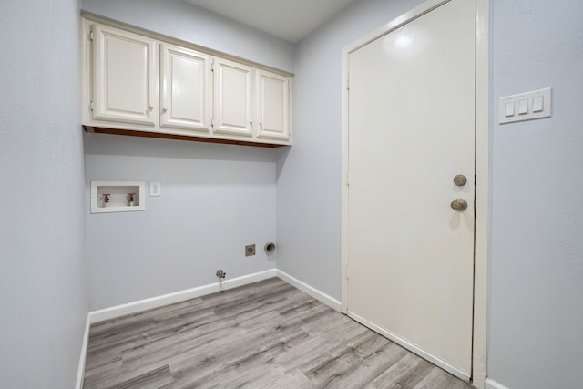 laundry room featuring electric dryer hookup, gas dryer hookup, cabinets, washer hookup, and light wood-type flooring