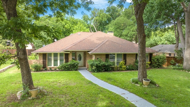 ranch-style house featuring a front lawn