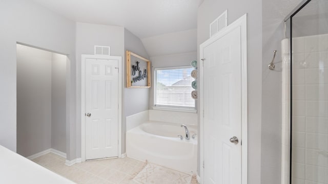 bathroom with lofted ceiling and plus walk in shower