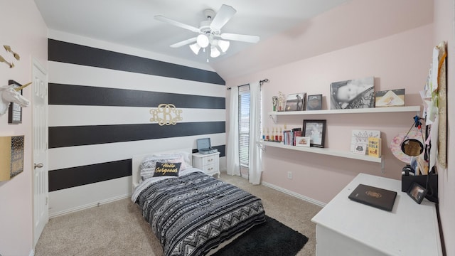 carpeted bedroom with ceiling fan and vaulted ceiling