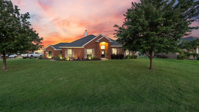 5333 Tree Grace Ln, Kaufman, TX 75142 - view of front facade with brick siding, a chimney, and a front yard