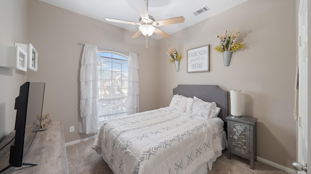 bedroom with ceiling fan and light carpet