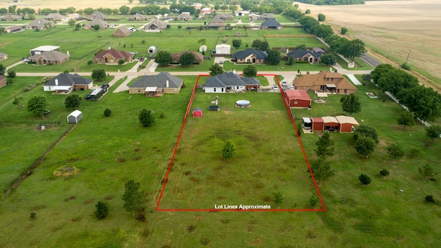 birds eye view of property featuring a rural view