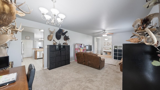 carpeted living room featuring ceiling fan with notable chandelier