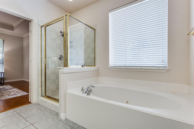 bathroom featuring ornamental molding, shower with separate bathtub, and tile patterned floors