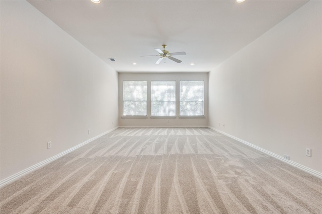 carpeted empty room with ceiling fan